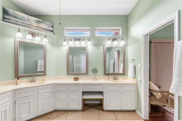 bathroom featuring tile patterned flooring and vanity