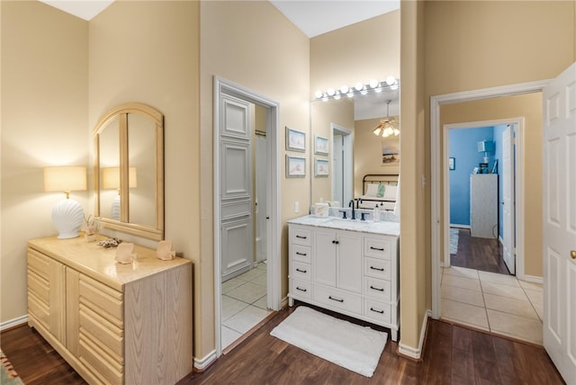 bathroom with vanity and hardwood / wood-style floors