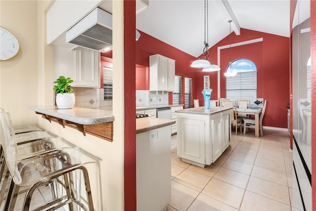 kitchen featuring white dishwasher, beam ceiling, a center island, white cabinets, and pendant lighting