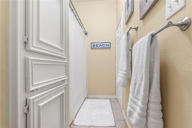 bathroom with tile patterned floors