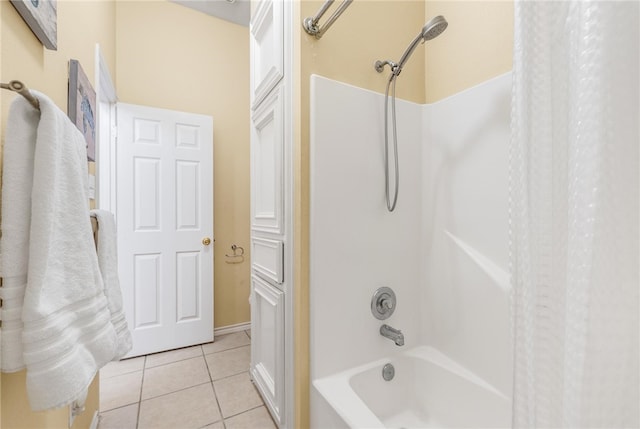 bathroom featuring shower / bath combo and tile patterned flooring