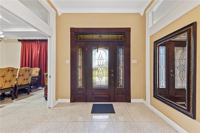 tiled entryway featuring ornamental molding