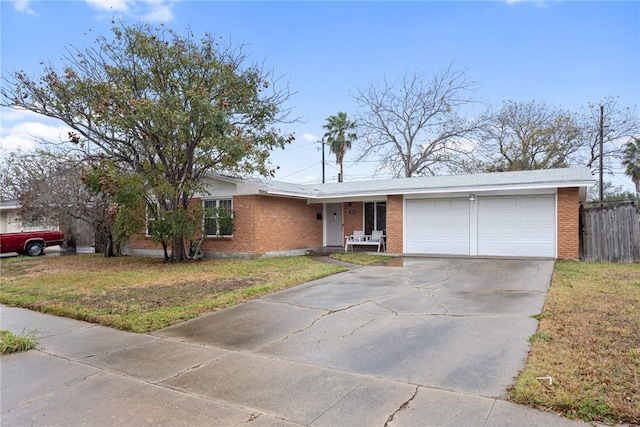 single story home with a front lawn and a garage