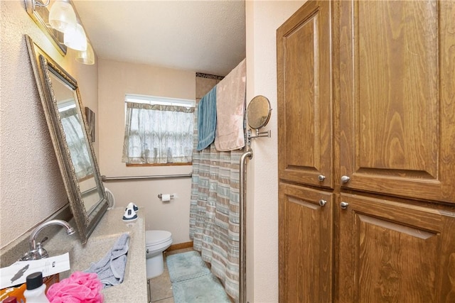 bathroom with toilet and walk in shower