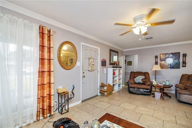 living room featuring ceiling fan, ornamental molding, and light tile patterned floors