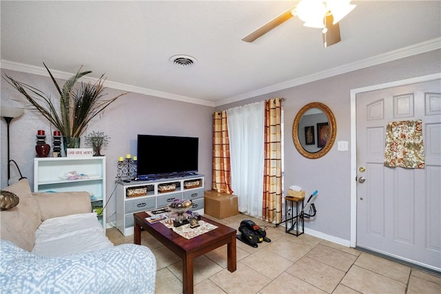 living room featuring light tile patterned floors, ceiling fan, and crown molding