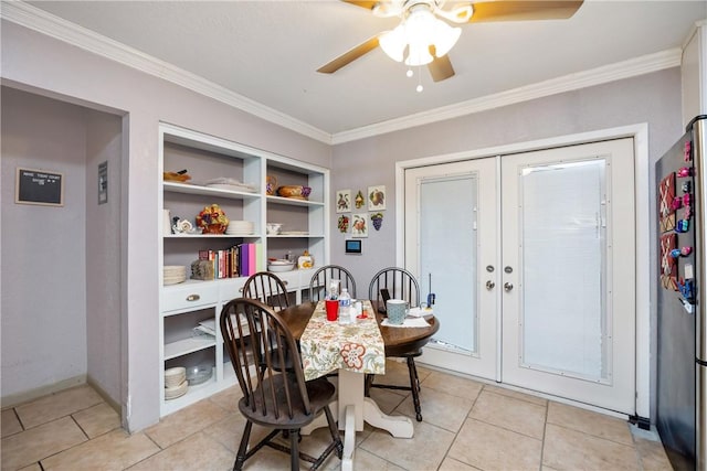 dining space featuring french doors, light tile patterned floors, and crown molding