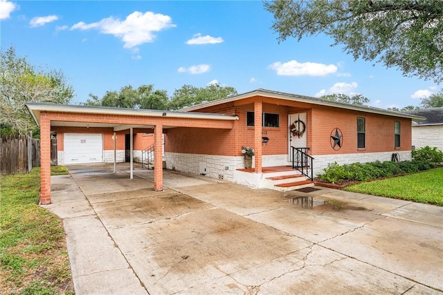 ranch-style home featuring a carport