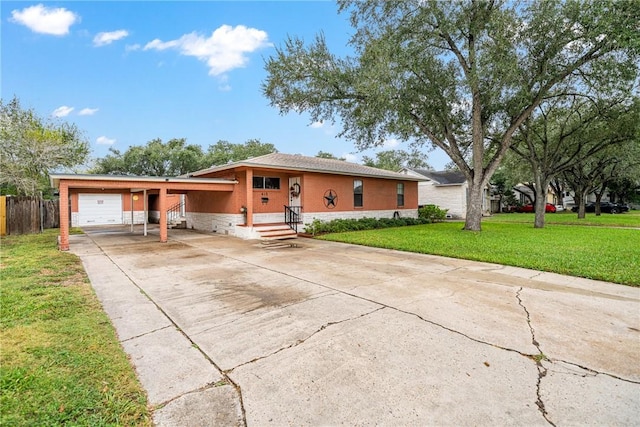 view of front of property with a carport and a front yard