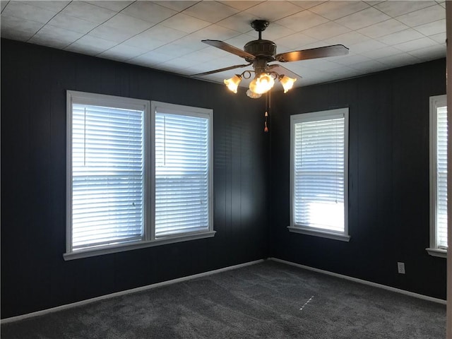 1222 18th St, Corpus Christi, TX 78405 - spare room featuring a ceiling fan and dark colored carpet
