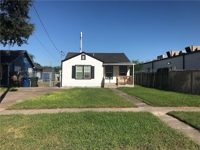 view of front of home with a porch and a front yard