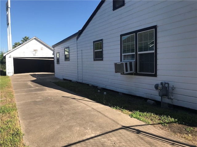 1222 18th St, Corpus Christi, TX 78405 - view of home's exterior featuring an outdoor structure and a garage