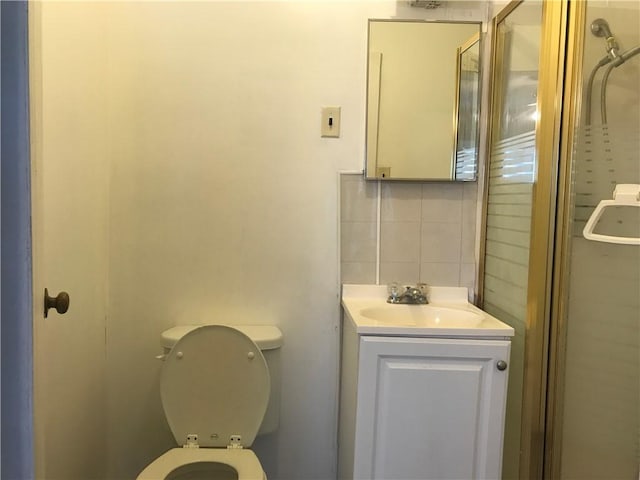 1222 18th St, Corpus Christi, TX 78405 - bathroom with backsplash, vanity, and a shower with door