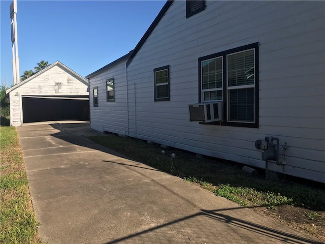 1222 18th St, Corpus Christi, TX 78405 - view of side of home with an outdoor structure and a detached garage