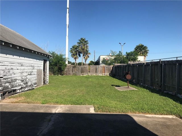 1222 18th St, Corpus Christi, TX 78405 - fenced backyard with a patio area