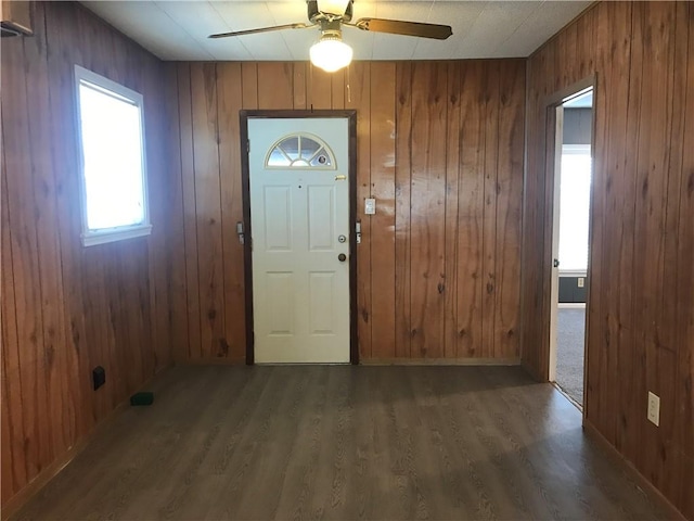 1222 18th St, Corpus Christi, TX 78405 - foyer featuring ceiling fan, wood finished floors, and wood walls