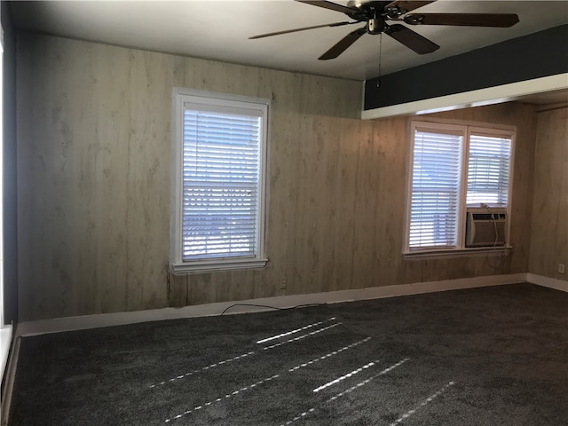 unfurnished room featuring ceiling fan, cooling unit, and carpet floors