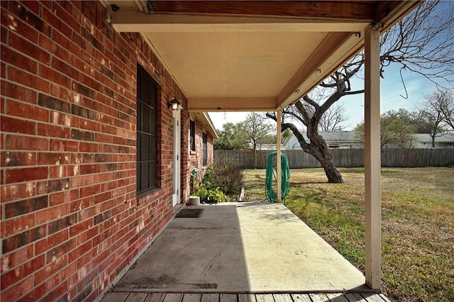 view of patio featuring fence