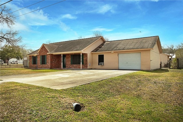 ranch-style home with driveway, brick siding, an attached garage, fence, and a front yard