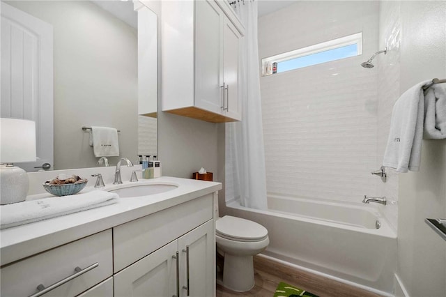 full bathroom with vanity, wood-type flooring, shower / bath combo, and toilet