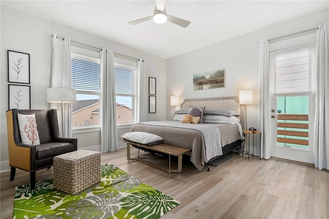 bedroom with light hardwood / wood-style flooring and ceiling fan