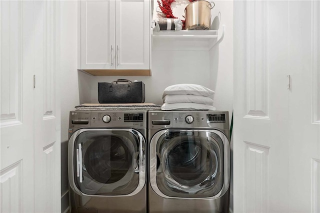 laundry area with cabinets and independent washer and dryer