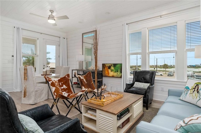 sunroom with ceiling fan and plenty of natural light