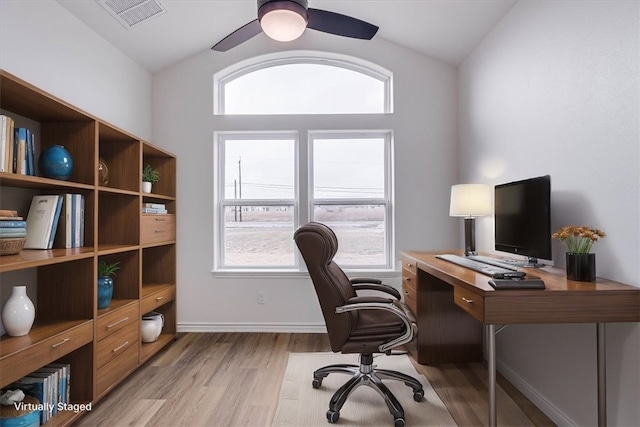 office area with vaulted ceiling, ceiling fan, and light wood-type flooring