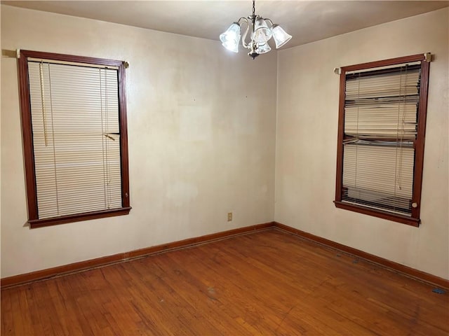 1202 Shiels Dr, Corpus Christi, TX 78412 - unfurnished room with a chandelier and hardwood / wood-style floors