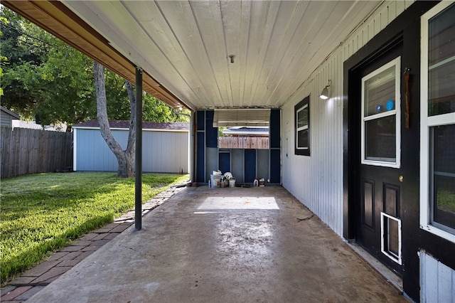 view of patio / terrace featuring a storage shed