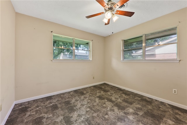 spare room with ceiling fan