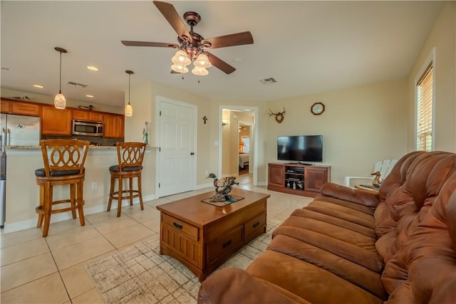 1549 S Commercial St Unit 8, Aransas Pass, TX 78336 - living area with light tile patterned flooring, ceiling fan, and recessed lighting