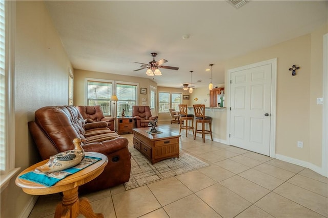 1549 S Commercial St Unit 8, Aransas Pass, TX 78336 - living room featuring a ceiling fan and light tile patterned floors