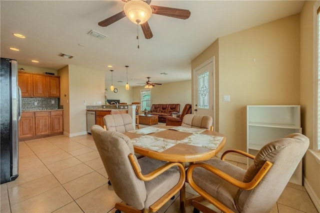 1549 S Commercial St Unit 8, Aransas Pass, TX 78336 - dining room with ceiling fan, light tile patterned floors, and recessed lighting