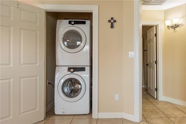1549 S Commercial St Unit 8, Aransas Pass, TX 78336 - washroom featuring stacked washer / dryer and light tile patterned floors