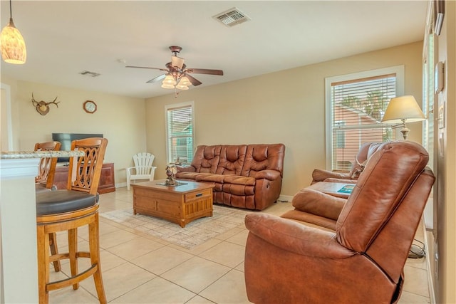 1549 S Commercial St Unit 8, Aransas Pass, TX 78336 - living room featuring light tile patterned flooring, plenty of natural light, and a ceiling fan