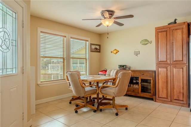 1549 S Commercial St Unit 8, Aransas Pass, TX 78336 - dining room with healthy amount of natural light, a ceiling fan, and light tile patterned floors