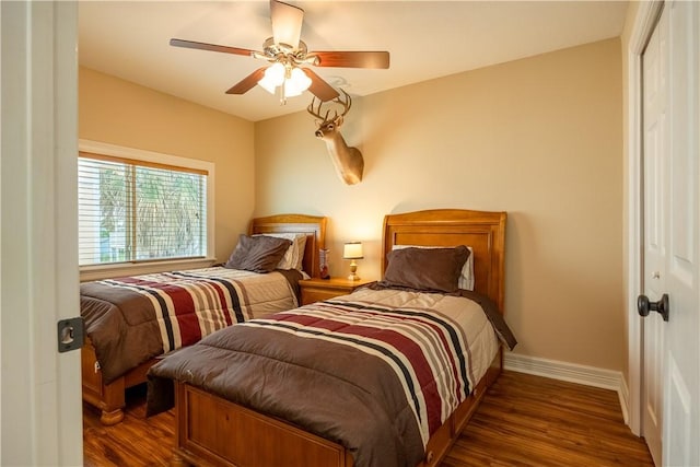 1549 S Commercial St Unit 8, Aransas Pass, TX 78336 - bedroom with wood finished floors, a closet, and a ceiling fan