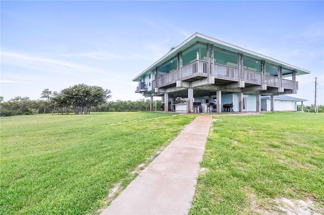 178 Smyth St, Port Oconnor, TX 77982 - view of front of property featuring a front yard and a deck