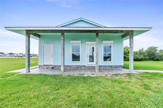 178 Smyth St, Port Oconnor, TX 77982 - rear view of house featuring a yard and a patio