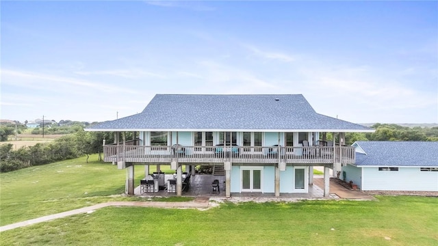 178 Smyth St, Port Oconnor, TX 77982 - rear view of house featuring a patio area, a yard, a deck, and a shingled roof