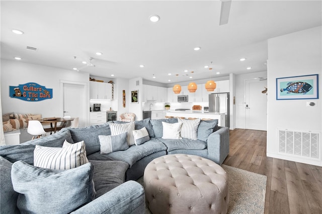 living room featuring beverage cooler and hardwood / wood-style floors