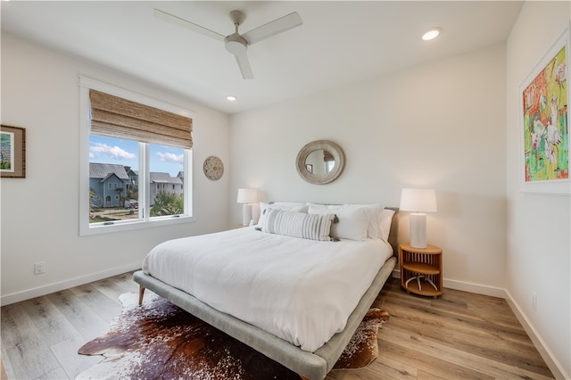 bedroom featuring ceiling fan and light hardwood / wood-style floors