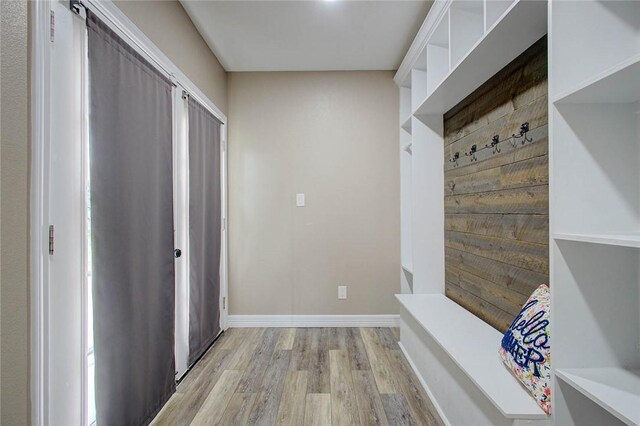 2111 Buckeye Dr, Ingleside, TX 78362 - mudroom featuring light wood finished floors and baseboards