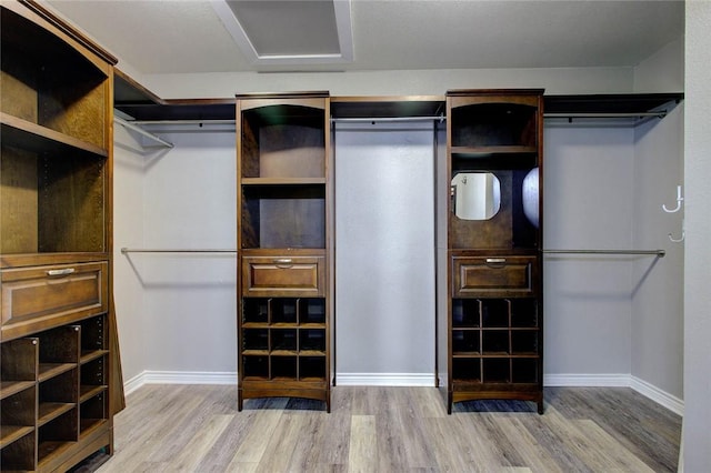 2111 Buckeye Dr, Ingleside, TX 78362 - walk in closet with wood finished floors