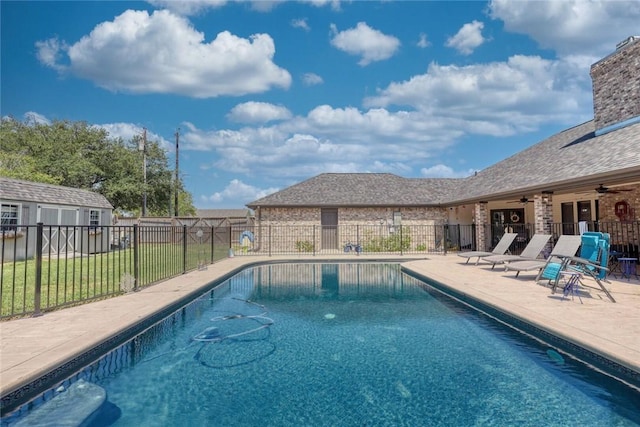 2111 Buckeye Dr, Ingleside, TX 78362 - view of pool featuring a ceiling fan, a patio area, and an outdoor structure