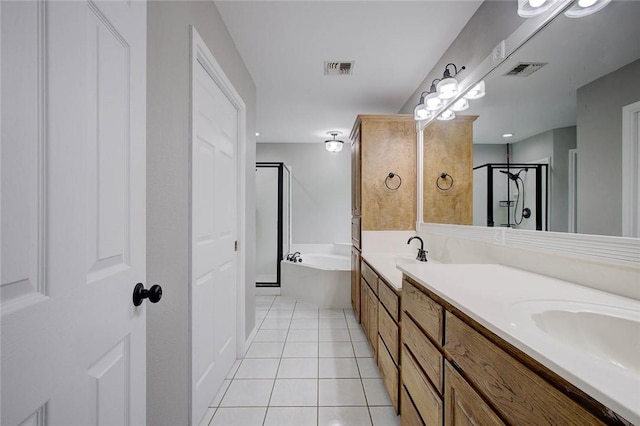 2111 Buckeye Dr, Ingleside, TX 78362 - full bath featuring tile patterned flooring, a shower stall, a bath, and double vanity