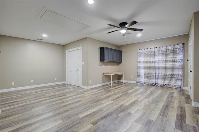 2111 Buckeye Dr, Ingleside, TX 78362 - unfurnished living room with attic access, a ceiling fan, light wood-style flooring, baseboards, and recessed lighting