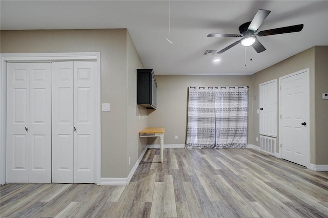 2111 Buckeye Dr, Ingleside, TX 78362 - bedroom with light wood-type flooring, baseboards, and a ceiling fan