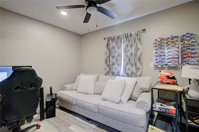 office space with ceiling fan and light hardwood / wood-style flooring